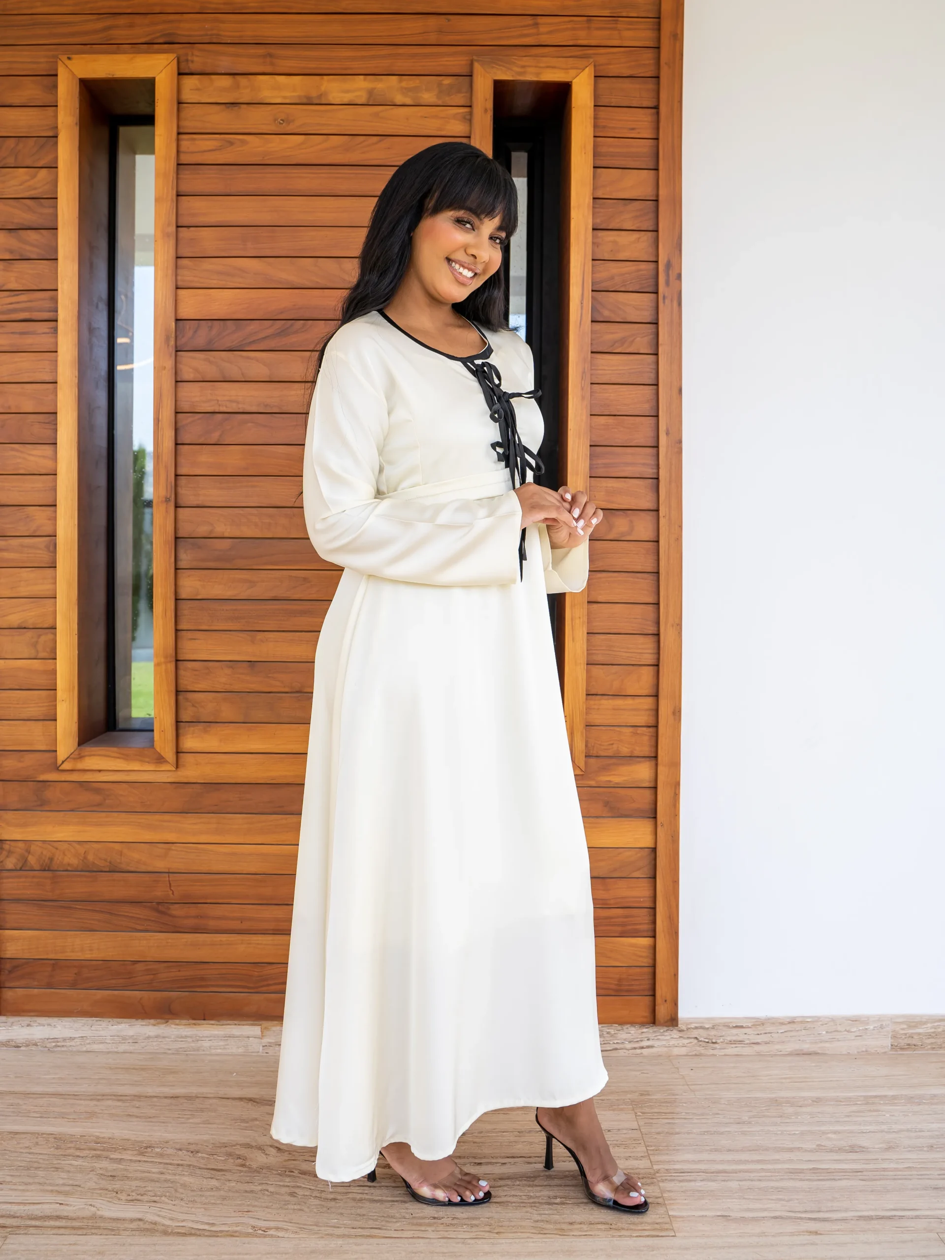 ivory modest maxi dress with black tie neckline